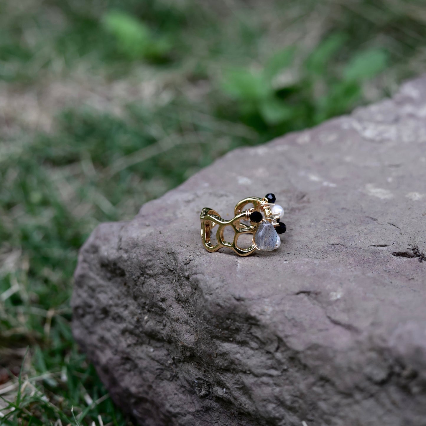 Stone cluster pearl ring lifestyle shot