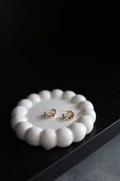 Checkered glaze mini hoops worn by model