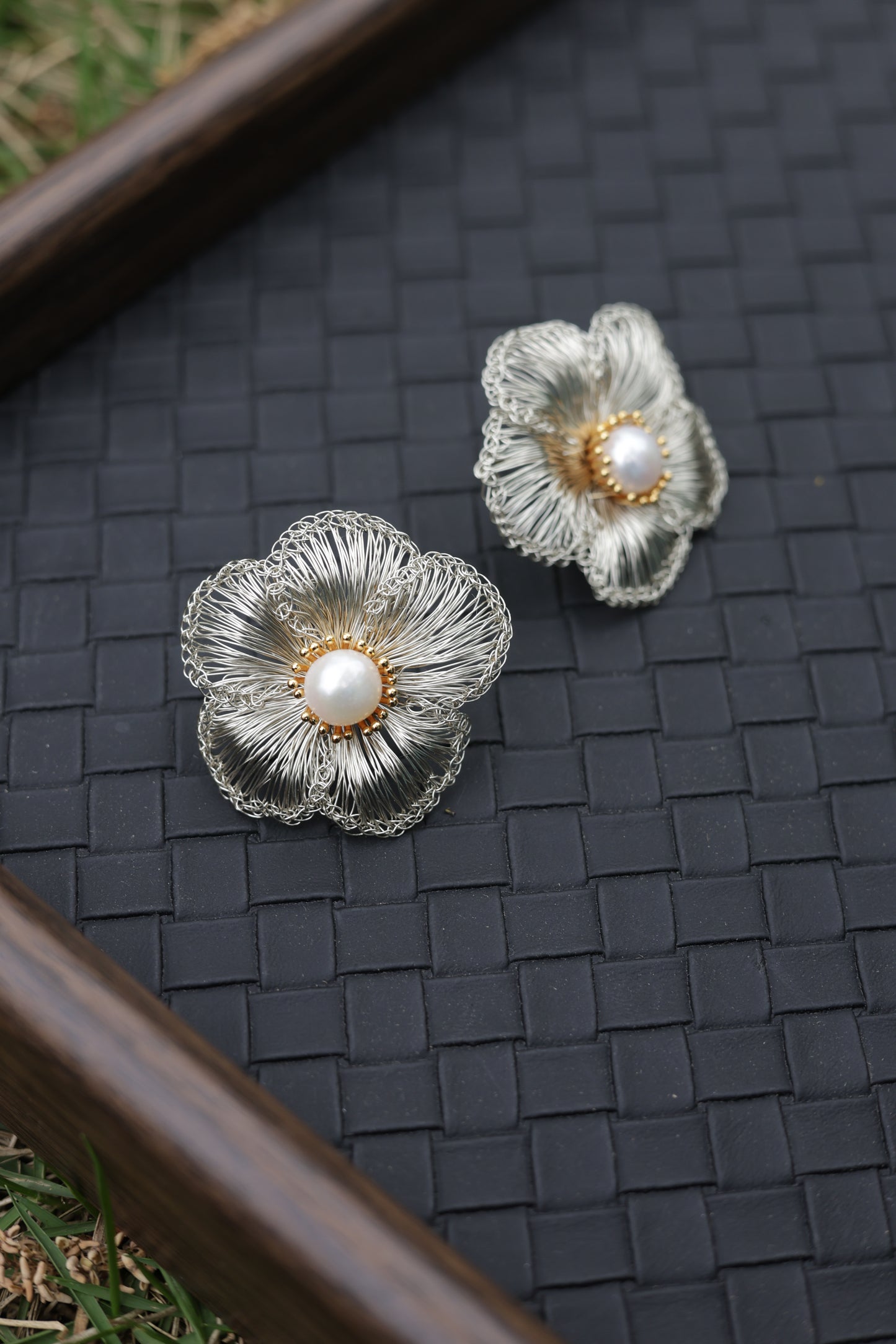 Silver petal pearl earrings front view