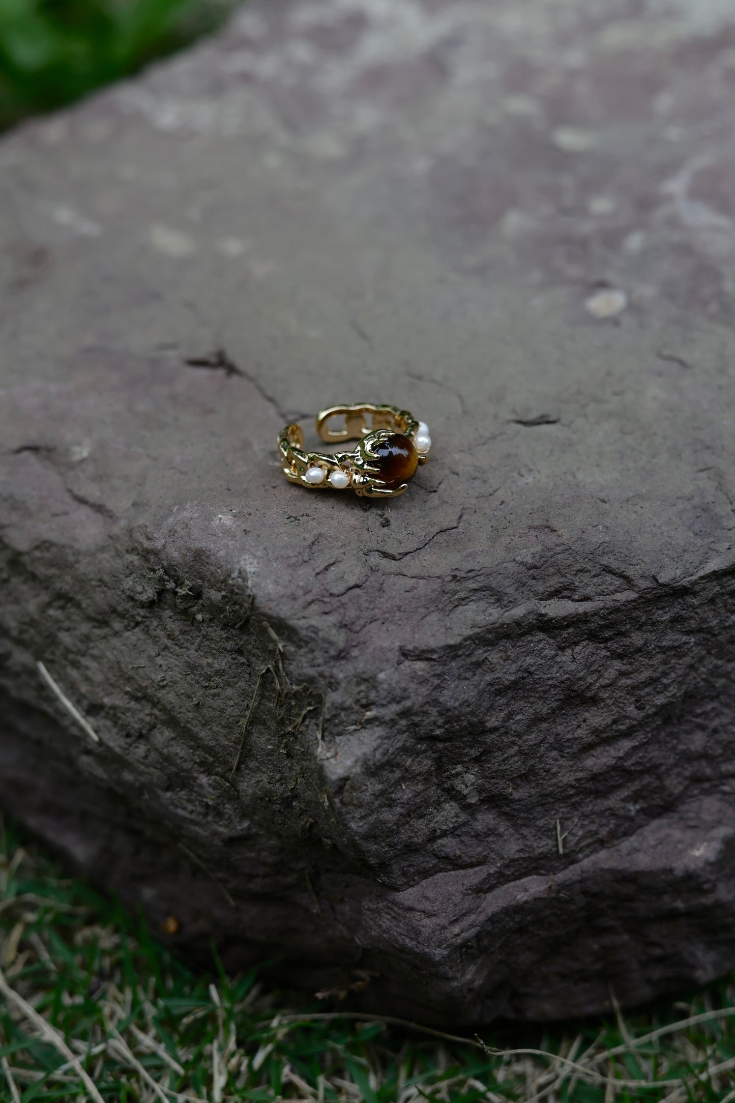 Amber stone pearl ring flat lay detail